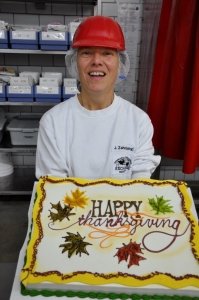 Jutta Zahrebelnyj, foreman of the bakery's cake shop, shows one of Thanksgiving cakes she made and decorated for customers