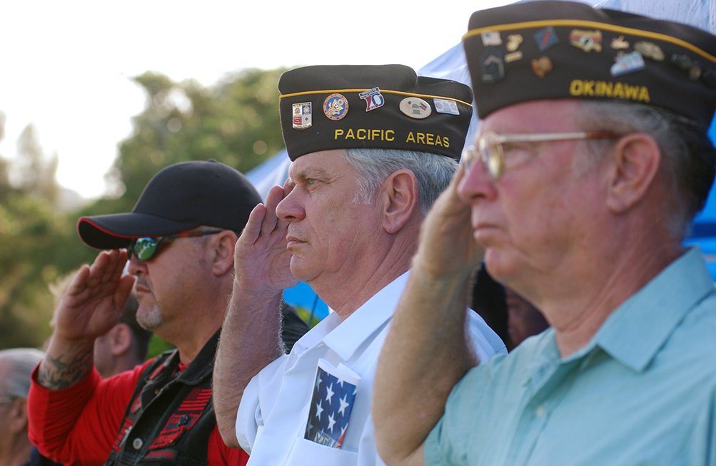 080526-F-5435-040 Veterans salute as flags are raised for the National Anthem during a Memorial Day ceremony at Kadena Air Base, Japan, May 26. Veterans and military members from all four branches of the military attended the event to remember those who died in our nation's service. (U.S. Air Force photo/Tech. Sgt. Rey Ramon) (Released)