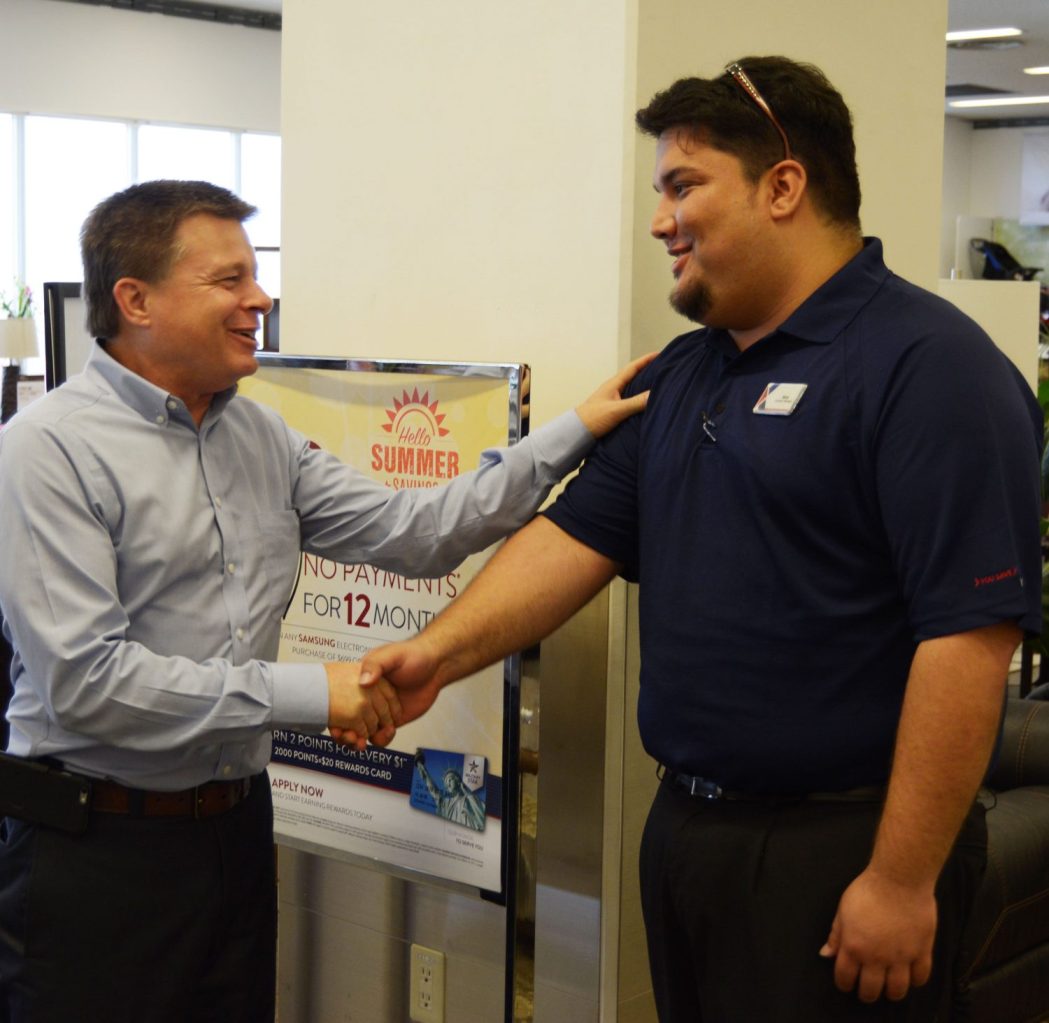 Okinawa Associate Nicholas Goya from Okinawa welcomes COO Dave Nelson to his facility.