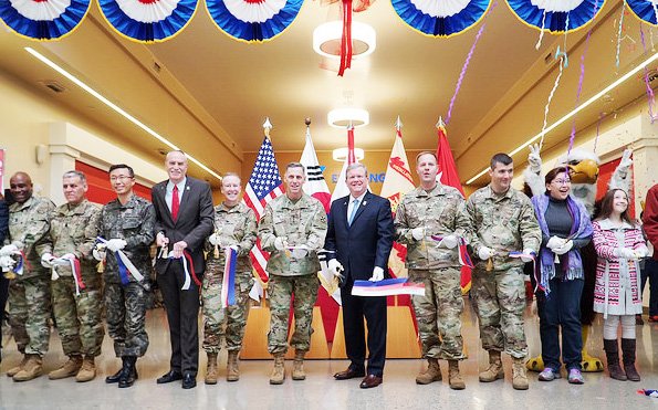 ribboncutting Director/CEO Tom Shull (center), Lt. Gen. Tom Vandal, commanding general, 8th Army, and other Exchange and military leaders ushered in a new shopping experience for Soldiers and families who call Camp Humphreys home.
