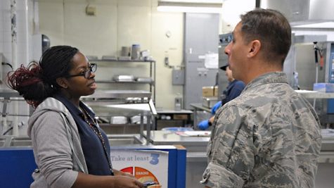 Summer Summer Turner tells Pacific Region Commander Col. Scott Maskery how she operates her school lunchroom.
