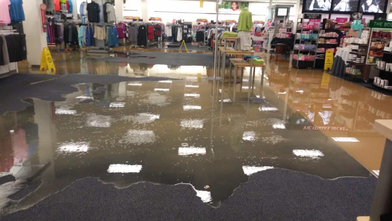 20180511_081329 NAS JRB Exchange Family Comes Together When Flooding Strikes - Water, rather than merchandise, occupies major space in the main store after a water pipe busted, shutting down the facility for five days.