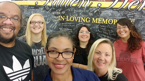 Main Store Manager Paula Bradford, front, and visual merchandisers at Fort Bliss created a display honoring Warfighters lost in action.