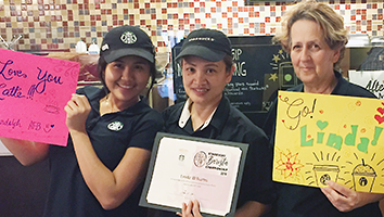 RandolphCoffee Pauline Ejercito, left, and Phyliss Razis, right, wish coworker Linda Williams all the best as she advances to an upcoming Starbucks barista area competition.
Linda Williams
Phyliss Razis