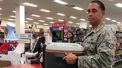 HurlburtField An Airman at Hurlburt Field, Fla., buys a cooler to prepare for Hurricane Michael.