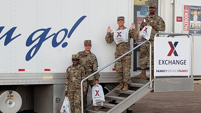 2 MFE Nov 2018 Soldiers come out of the mobile field exchange at Davis-Monthan AFB with sacks full of basic necessities.