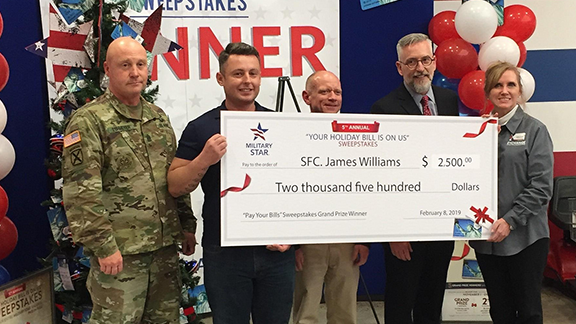 FortBraggMILSTAR Left to right, Garrison Command Sgt. Maj. William D. Lohmeyer, SFC James Williams, Fort Bragg General Manager Bill Shoffner, Exchange Executive Vice President and Chief Financial Officer Jim Jordan, and Store Manager Trish Jones.