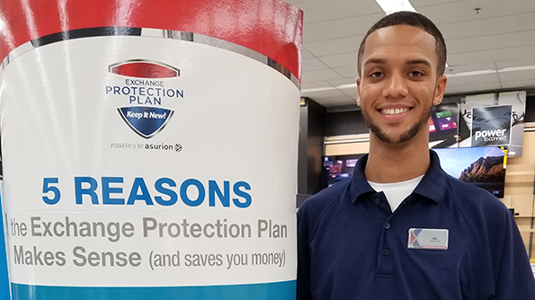 20170602_144050 Associate beside an Exchange Protection Plan promotional sign.