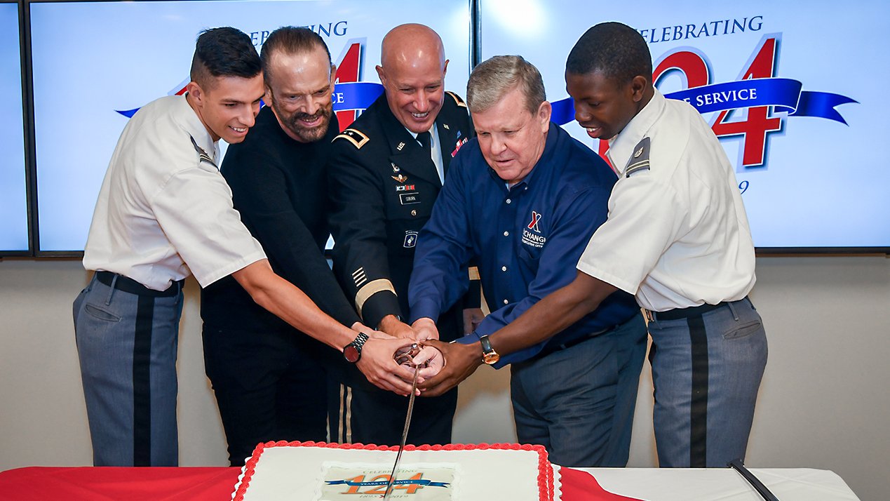 124th-AAFES-74 From left, West Point Cadet CPT Christian Faulk; Senior Vice President James Skibo, who recently celebrated 50 years with the Exchange; Commander Maj. Gen. David Coburn, Commanding General of the U.S. Army Financial Management Command, Director/CEO Tom Shull; and West Point Cadet Thomas Bordeaux cut the ceremonial cake.
