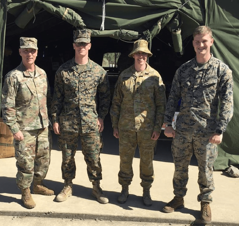 Col Maskery with MRF-D Marines and LTC Benefield AUS Army - Camp Growl - 15 July 2019 Exchange Pacific Region Commander Col Scott Maskery, left, meets with Australian Army LTC Benefield, second from right, Camp Commandant, Camp Growl, Shoalwater Bay Military Training Area, about the mobile field exchange’s operations and capabilities. They are joined by U.S. Marines LCPL Julian Leyva, second from left, and SGT Chad Elders, right.
