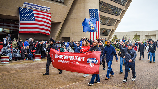 2019-Vet-Parade-310 With the wind a little calmer, Exchange managers and associates pass in front of the Dallas City Hall. The 2019 Veterans Day Parade was held to commemorate the 75th anniversary of the Normandy invasion.