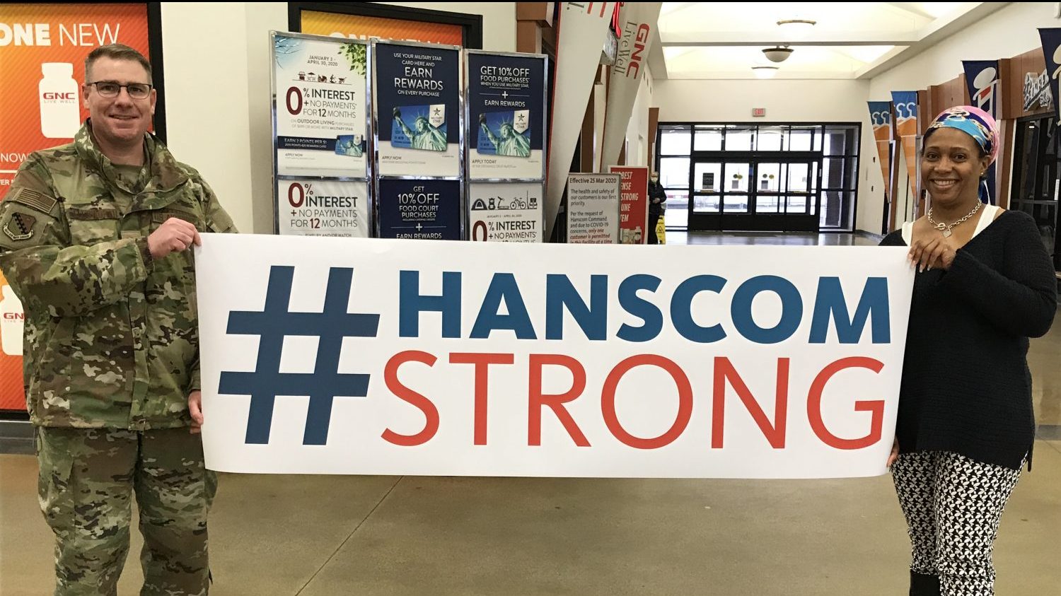 Hanscom Strong Day image Hanscom AFB Commander Col. Chad Ellsworth and Exchange HR recruiter Nora Pile display a banner on April 3 Hanscom Strong Day.