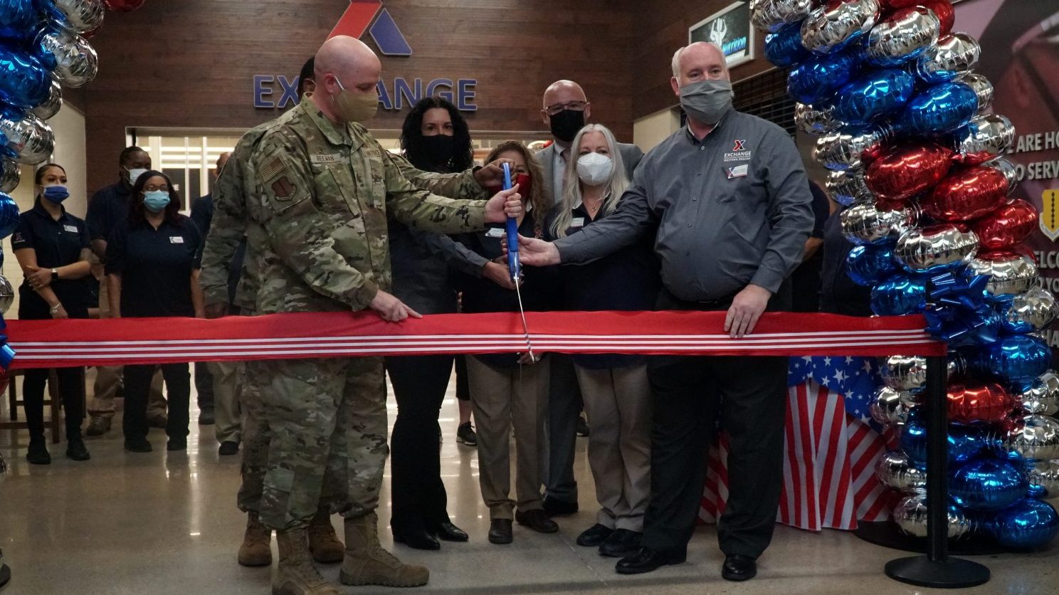 Goodfellow GO 17th Training Wing Commander Col. Matthew R. Reilman (second from left) helps Army & Air Force Exchange Service officials cut the ribbon on a newly renovated Goodfellow Air Force Base Exchange shopping center Aug. 5. Also pictured from left, Exchange Senior Enlisted Advisor Air Force Chief Master Sgt. Kevin Osby, Goodfellow AFB Exchange General Manager Bettina Ciciriello-Frederick, Military Clothing Store Manager Martha Scarlett, Exchange Chief Operating Officer Jason Rosenberg, Goodfellow AFB Exchange Main Store Manager Lisa Piper and Exchange Southwest Region Vice President Wayne Hansen.