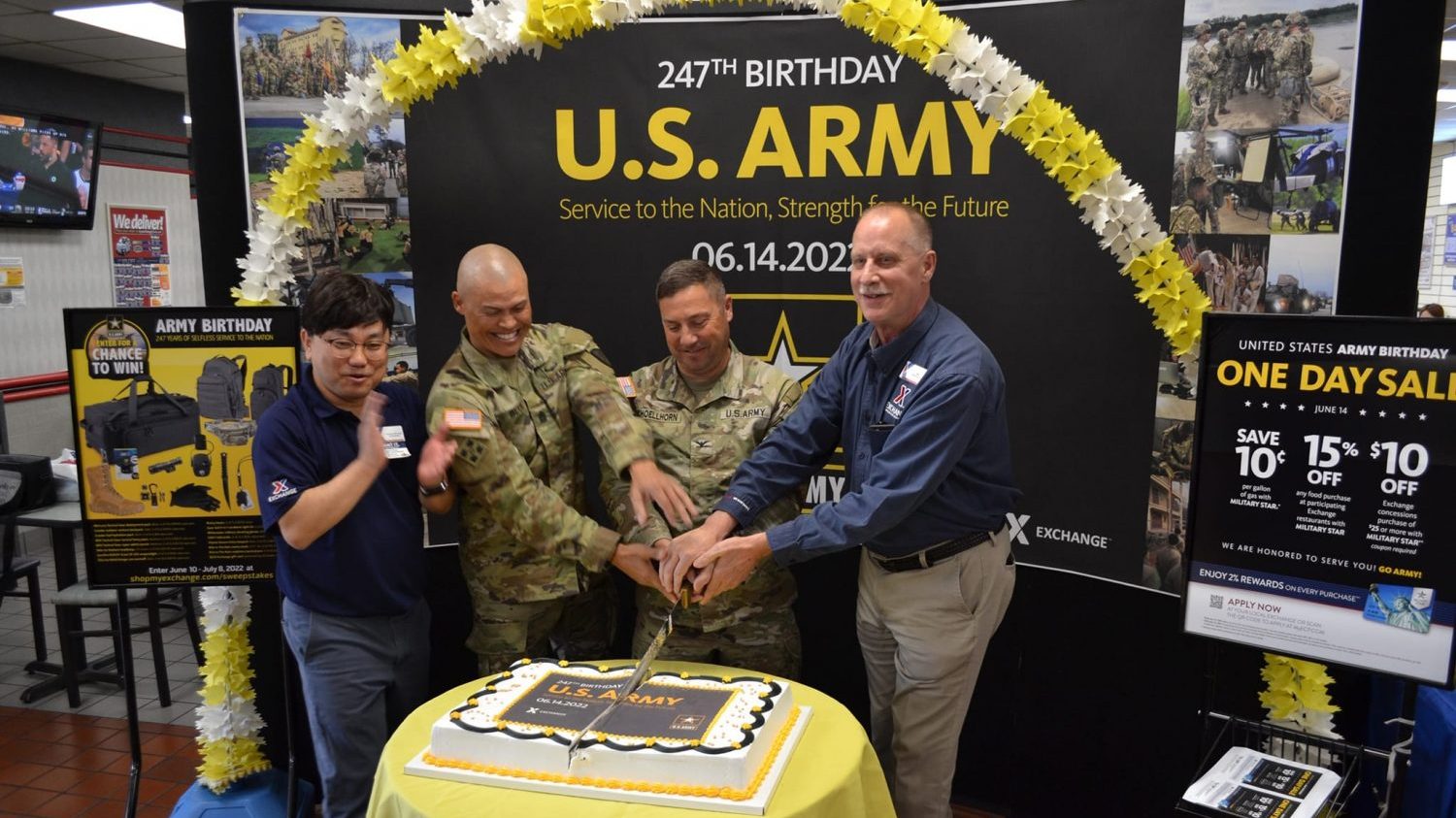 127th Army birthday_Korea Southern <b>From left: Korea Southern Exchange Store Manager Chinman Chong, U.S. Army Garrison Daegu Command Sgt. Maj. Jonathon J. Blue, Garrison Commander Col. Brian P. Schoellhorn and General Manager Bill Ripley cut the cake for the store's 247th Army birthday celebration.</b>