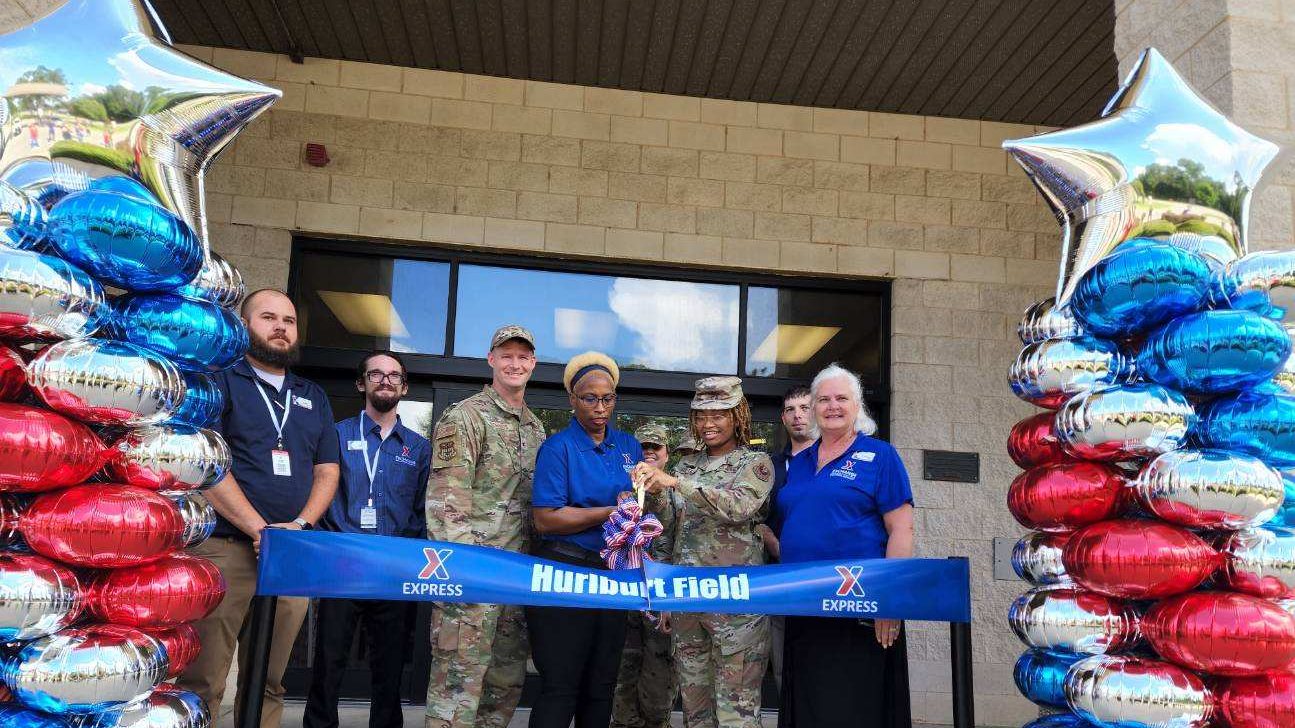 Hurlburt Field Express <b>From left, Hurlburt Field Express Shift Manager Adam Roggenkamp, Express Shift Manager James Culver, 1st Special Operations Mission Support Group Commander Col. Dustin Richards, Express Facility Manager Larissa Odom, Senior Airman Vivian Abram and Exchange General Manager Sheila Clark cut the ribbon on the upgradedd Hurlburt Field Express on July 22.</b>