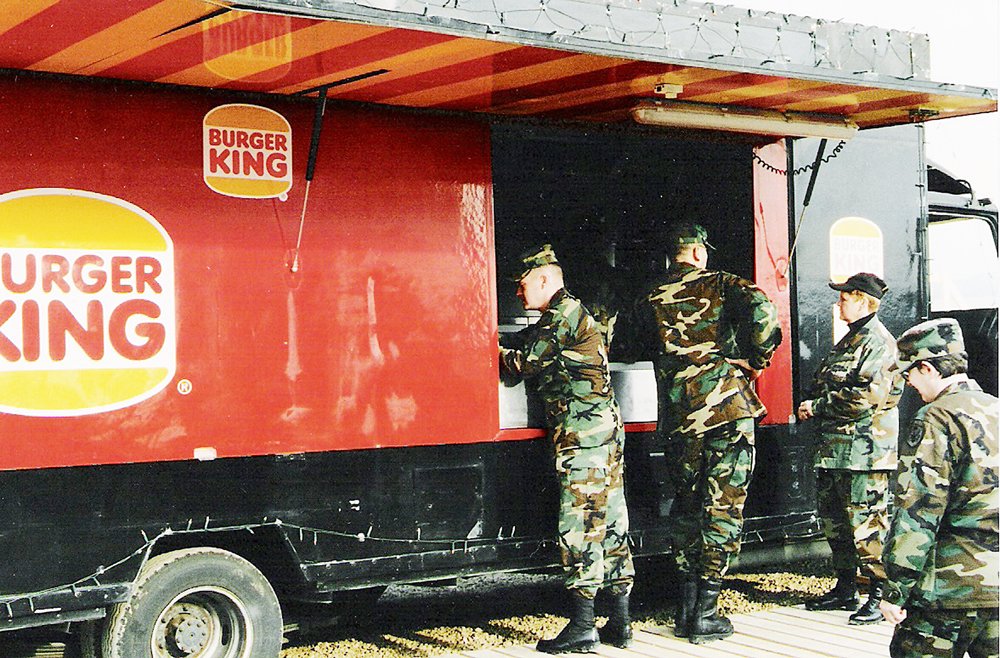 <b>American troops stop by Burger King’s first mobile unit, opened April 18, 1996, at Taszar Life Support Area in Hungary.</b>