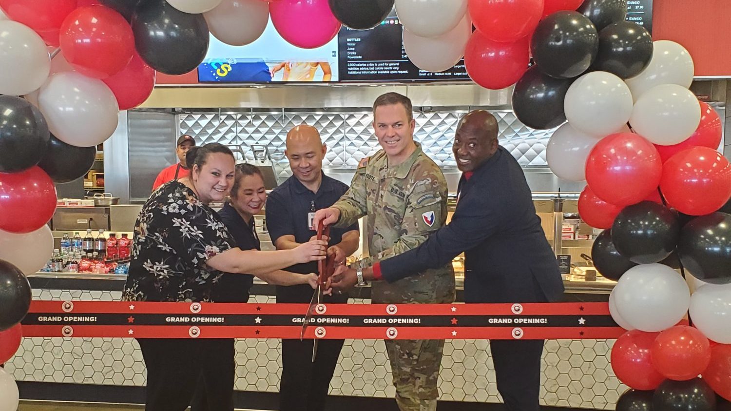 Fort Riley Panda Express GO <b>From left: Exchange Services Business Manager Jessica Tacy, Panda Express Region Manager Meggie Tran, Panda Express Owner Kenny Trinh, Garrison Commander Col. Michael Foote and Exchange General Jermaine Wilson cut the ribbon on the new restaurant at Fort Riley.</b>