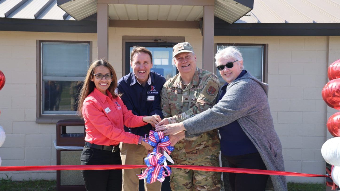 ANG ribbon cutting <b>Exchange leaders and the Gulfport Air National Guard Commander cut the ribbon on the renovated facility. From left: Exchange General Manager Madeline Salazar, Facility Manager Edward Jester, Gulfport Air National Guard Commander Col. Robert Kirby and NG Supervisor Kathleen Smith.</b>