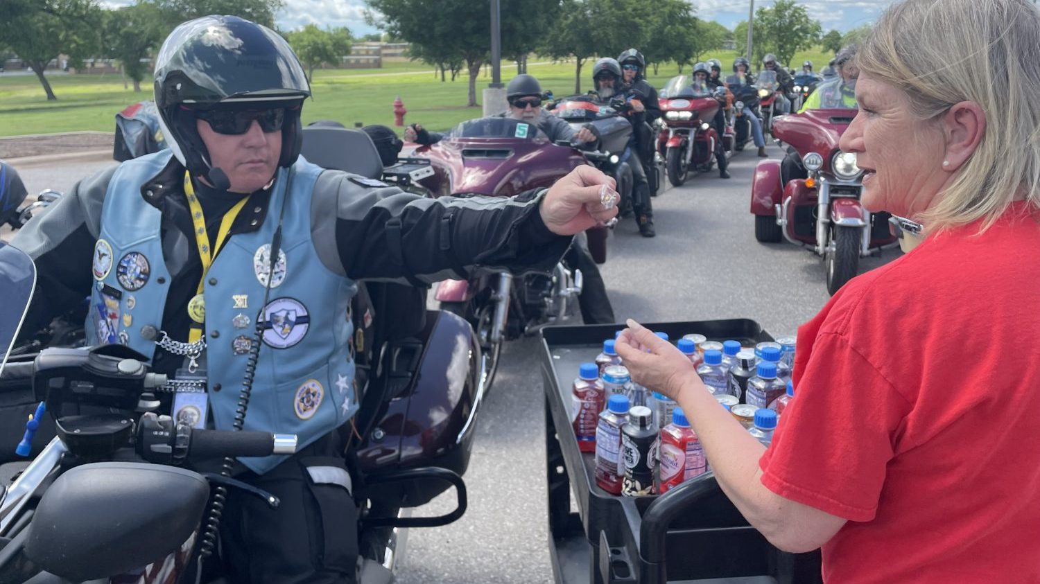 Fort Sill_Run for the Wall_lapel pin <b>Theresa Jones, Fort Sill customer experience associate, receives a special lapel pin from one of the "Run for the Wall" riders.</b>