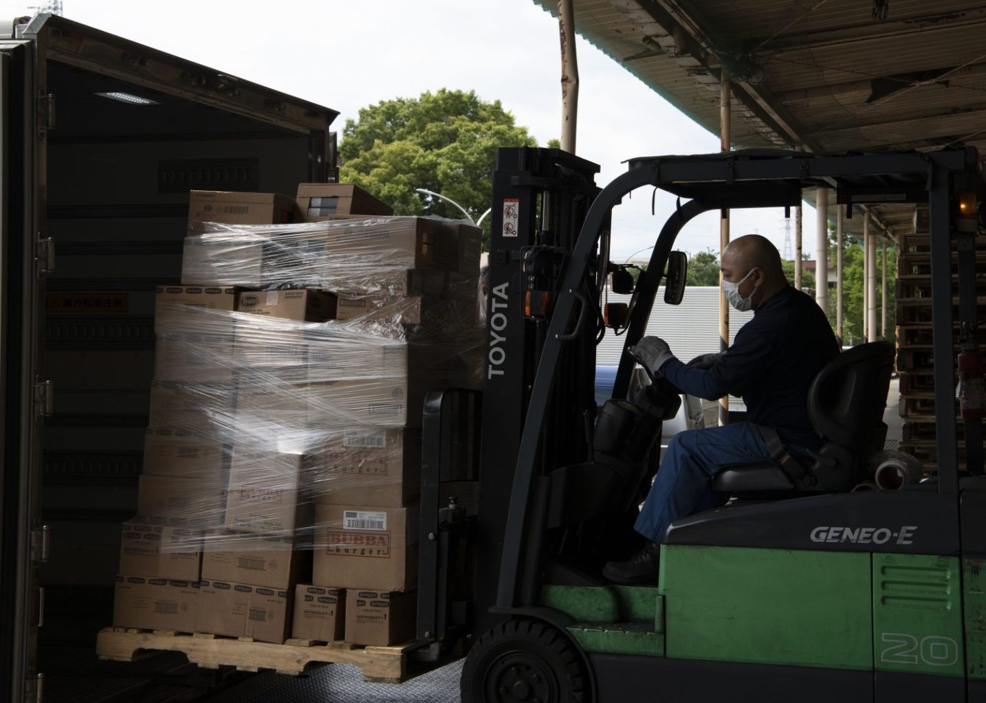 <b>Hiroshi Tokuyama, a Japan Distribution Center associate, loads frozen products onto a truck at Yokota Air Base, Japan, June 1, 2023. AAFES, the 374th Airlift Wing, and the 730th Air Mobility Squadron worked together to airlift food supplies to Guam as part of relief efforts following Typhoon Mawar, the strongest typhoon to hit the territory since 2002, according to the National Oceanic & Atmospheric Administration. (U.S. Air Force photo by Airman 1st Class Samantha White)