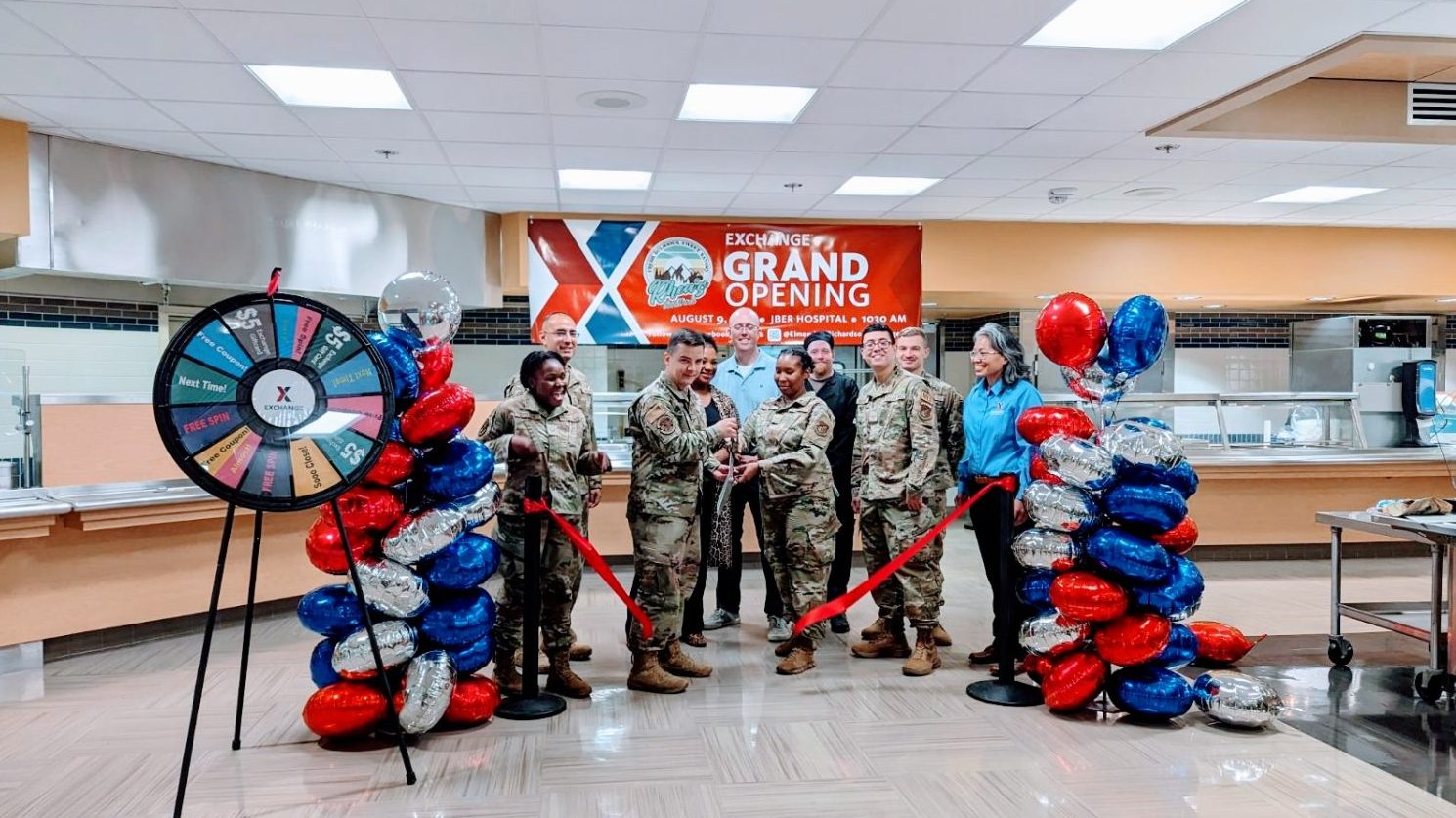 Airmen accompany , third through fifth from the left: 673d Air Base Wing Commander Col. David J. Wilson, Services Business Manager Dahlia Haliburton, Rhea’s owner Jason Smith, and (far right) Exchange General Manager Keola Chan at the ribbon-cutting for Rhea's Food Park in the Joint Base Elmendorf-Richardson hospital.</b>