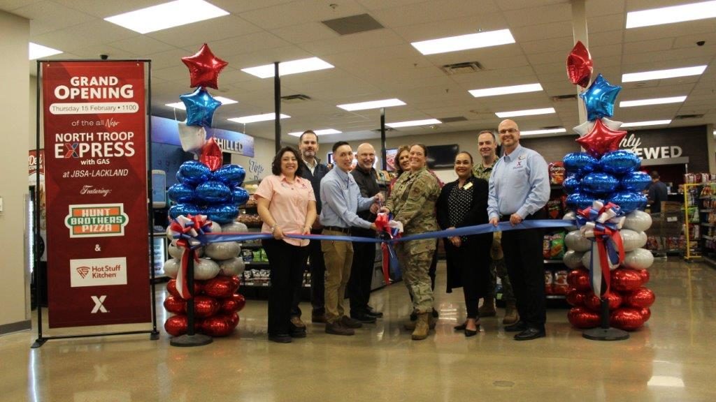NT9 <b>From left: Assistant Store Manager Erika Rivera, OLM representative Sean Easlick, Hunt Brothers Pizza representative Eddie Langston, Jim Tery Group representative Bambi Singleton, 502nd Force Support Group Deputy Commander Lt. Col. Gina Schneider, OSC representative Licely Torres Carrillo and JBSA - Lackland/Randolph General Manager Mikel Hunter.</b>