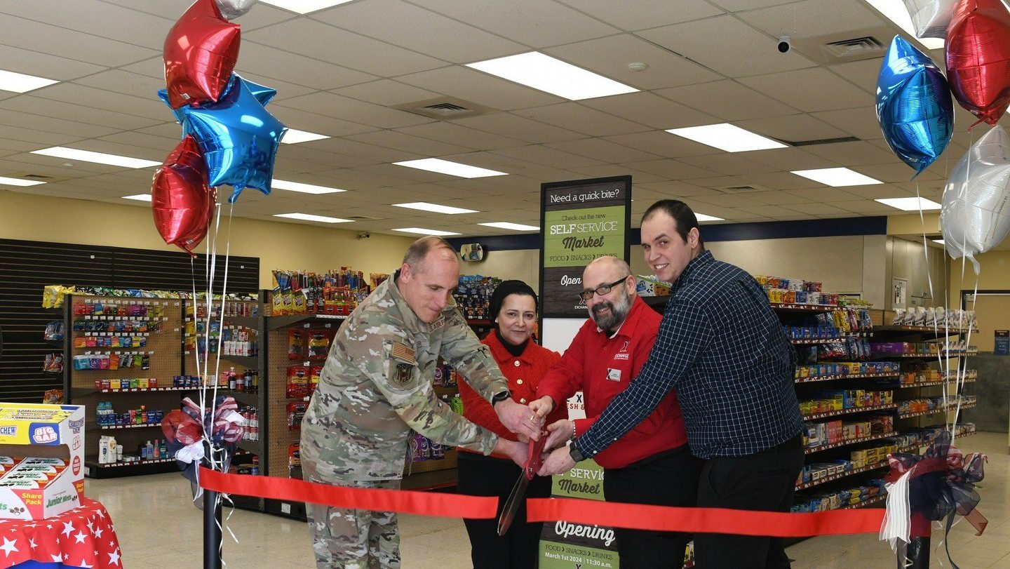 Battle Creek 1 Leadership cut the ribbon on the full-size unattended retail market at the grand opening event. From left: Wing Commander Col. Daniel Kramer; Exchange Services Business Manager Doaa Hassan; General Manager Charles Thrasher; and The Snack Guys LLC President Bryan Grasso Shonka.