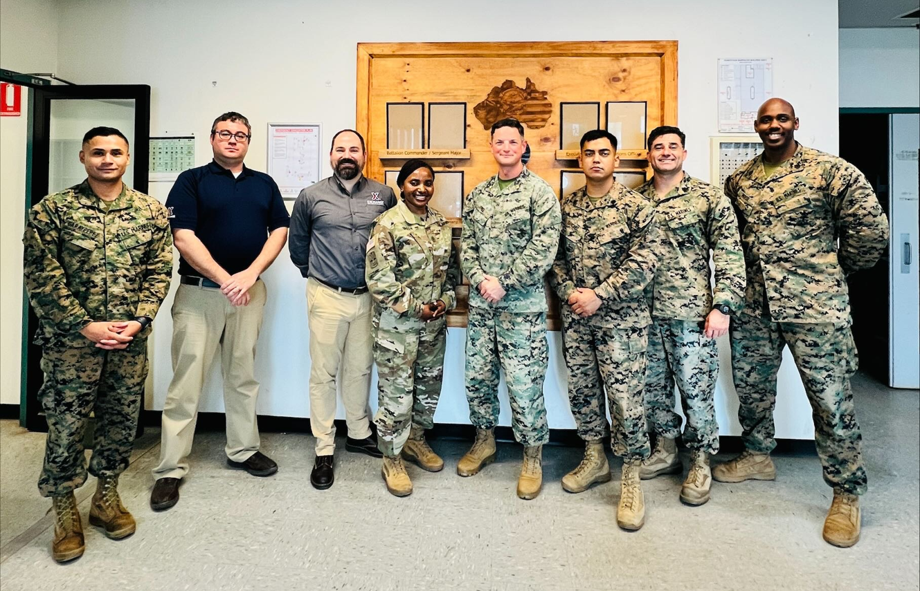 Rotational Force-001 <b>Okinawa Retail Business Manager Danny Cawood, Pacific Region Retail Program Specialist Jonathan Brickey and Pacific Region Senior Enlisted Advisor Sgt. Maj. Generose Green with Marines at Robertson Barracks in Australia. Standing next to Green is Maj. Jack Free, the officer in charge of the "Wet" season detachment. In a joint venture that began in 2016, Marines operate the Exchange's Robertson Barracks stores, while the Exchange provides the merchandise.
