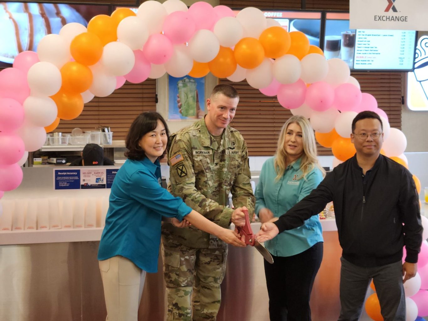 Camp Humphreys_Dunkin <b>From left: Camp Humphreys Exchange Service Business Manager Choe, Un-hye, Garrison Commander Col. Ryan Workman, Main Store Manager Tonya Jones and Dunkin’ owner Yang, Kyong-sok cut the ribbon on the relocated Dunkin’ on May 21.</b>
