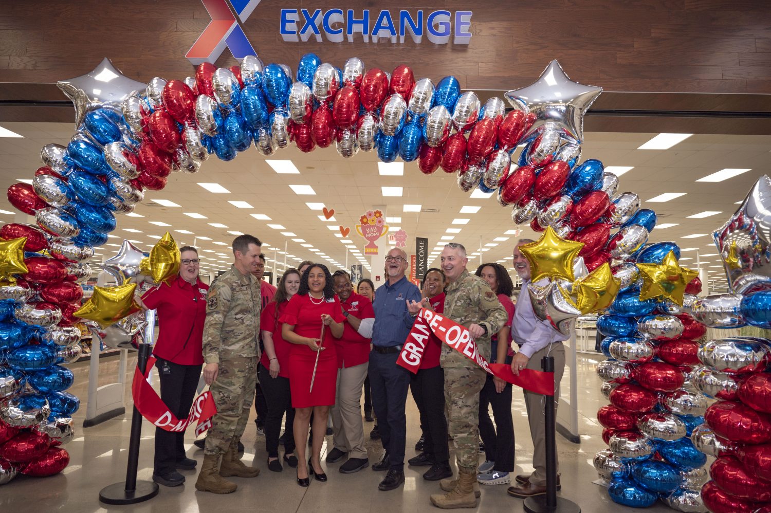 Davis-Monthan IU ribbon cutting Front row, from left: Davis-Monthan Exchange Sales & Merchandise Manager Mary Ann Brooks; Col. Scott Mills, 355th Wing commander; Davis-Monthan General Manager Hafeeza McCullough;Ronny Rexrode, Exchange Western Region senior vice president; Col. Casey Bartholomew, 355th Mission Support Group commander; and Ronny Rexrode, Exchange Western Region senior vice president.