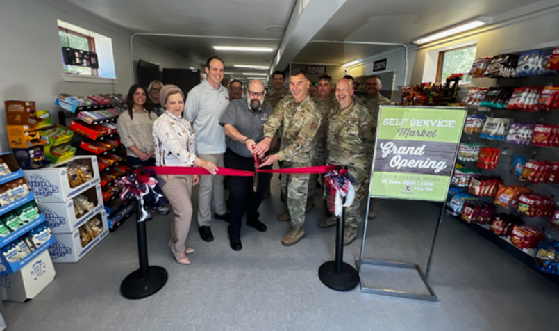 Selfridge_Alpena URU <b>From left: Services Business Manager Doaa Hassan; The Snack Guys LLC Owner Bryan Grasso; General Manager Charles Thrasher; Base Commander Col. James M Rossi; and Master Sgt. James Fuller.</b>