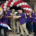 Exchange leaders and a Fort Cavazos Soldier cut the ribbon on the renovated Warrior Way Express.