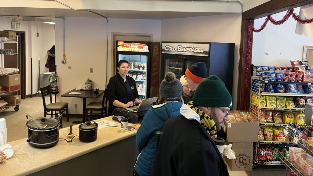 Joint Base Elmendorf-Richardson associate Kryzia Ceja at the Hillberg Ski Area snack bar cash register.