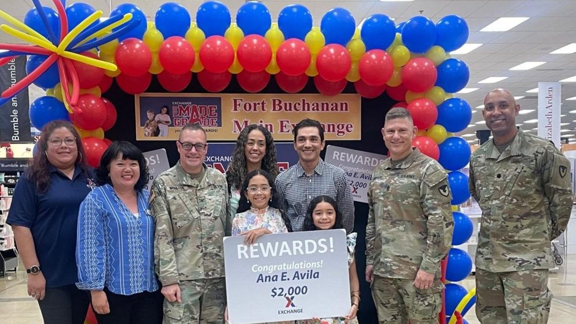 Fort Buchanan_YMTG_First <b>From left: Fort Buchanan Exchange Assistant Store Manager Gisela Rivera; General Manager Rochelle Tolentino, Garrison Commander Col. Charles Moulton, mother Johannie Santiago, father Eduardo Avila, winner Ana Avila, sister Emma Avila, Command Sgt. Major. Sgt. Maj. Roderick Hendricks, Deputy Garrison Commander Lt. Col. Sean Cook.</b>