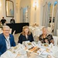 Exchange Director/CEO Tom Shull, Vice President of Marketing Customer Engagement Julie Mitchell and Senior Vice President of Brand Marketing Sandi Lute at a ballroom table at the 2024 Ragan PR Daily’s Content Marketing Awards at the Yale Club in New York City.