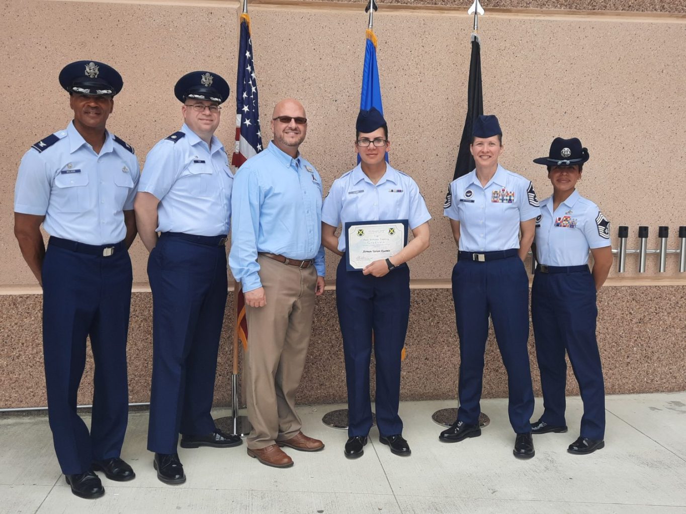<b>From left: 737th Training Group Commander Col. Billy Wilson Jr.; 326th Training Squadron Commander Lt. Col. James Cox; General Manager Mikel Hunter; Airman Tatian Kusmin; and JBSA-Lackland Airmen.</b>


