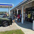 Customers form a line outside the Patrick Space Force Base Express after Hurricane Milton.