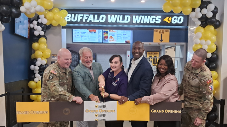 Fort Riley_BWWGO_Grand Opening3 <b>From left: Garrison Commander Col. Gerald Nunziato Jr.; Inspire Brand Franchisee Owner George Hart; Services Business Manager Jessica Tacy; General Manager Jermaine Wilson; North Central Region Vice President Vanessa Rowland; and Command Sgt. Maj. John Adkerson.<.b>