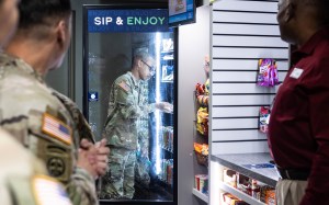 A Fort Knox Soldier looks at the selection at a new Fort Knox unattended retail unit.