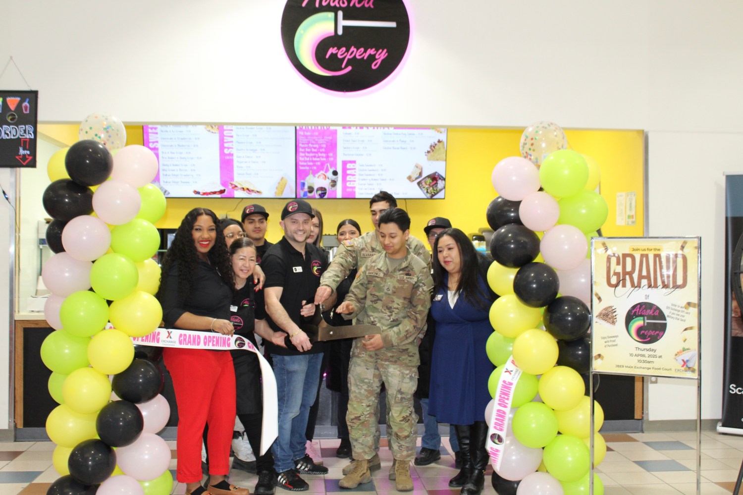 Celebrating the opening of Alaska Crepery, from left: PIC 9575 Left to right Services Business Manager Dahlia Haliburton, Services Operations Assistant Whitney Link, Alaska Crepery owner Fransico Gallo and staff. PFC Alvarado, PFC Sanchez an Services Business Tech Jacquline Justiniano.  