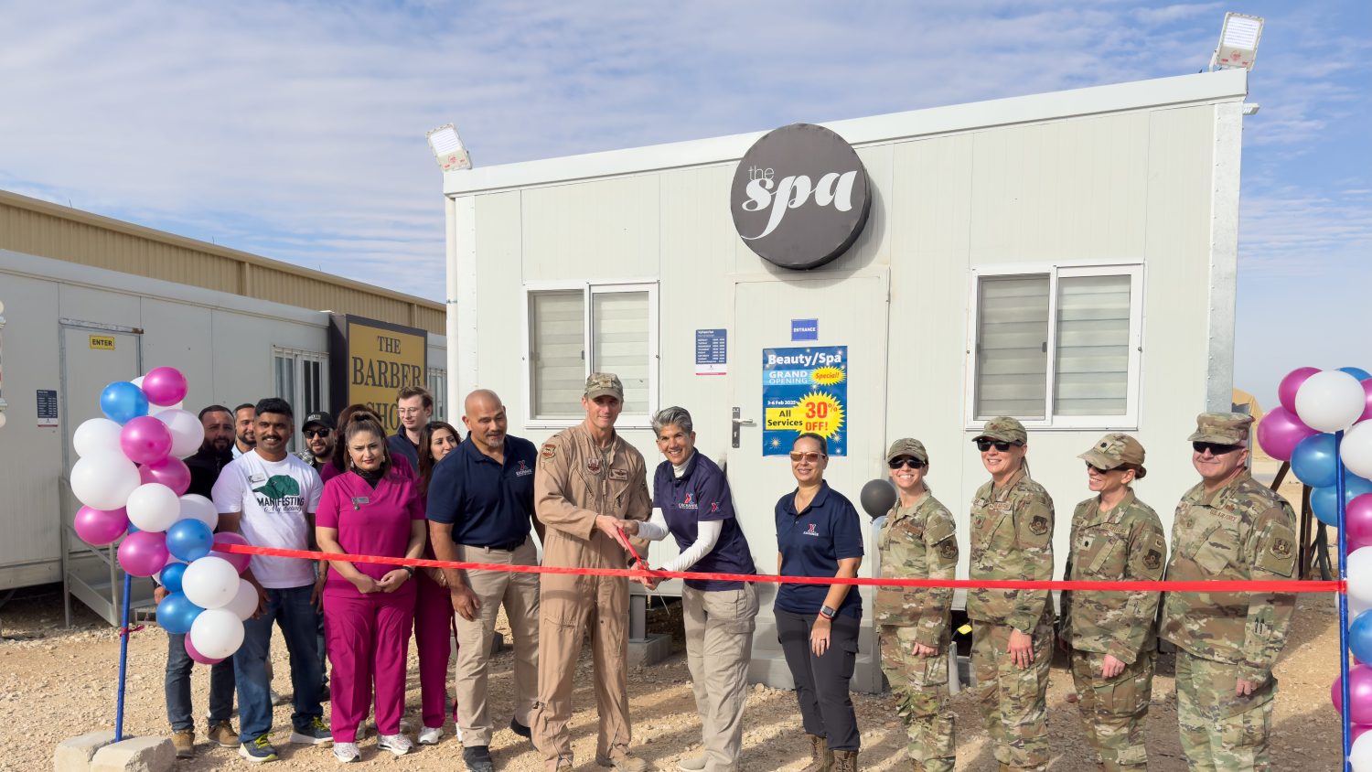 Army and Air Force Exchange Service opens new Beauty Shop and Spa U.S. Air Force Col. David Gunter and Elizabeth A. Goodman-Bluhm, regional vice president of the Army and Air Force Exchange Service, prepare to cut the ribbon on the new Spa, flanked by wing and AAFES staff in the U.S. Central Command area of responsibility, Feb. 3, 2025. With thousands of facilities worldwide, AAFES supports the warfighter and the AOR. (U.S. Air Force photo by Capt. Casey D. Mull)