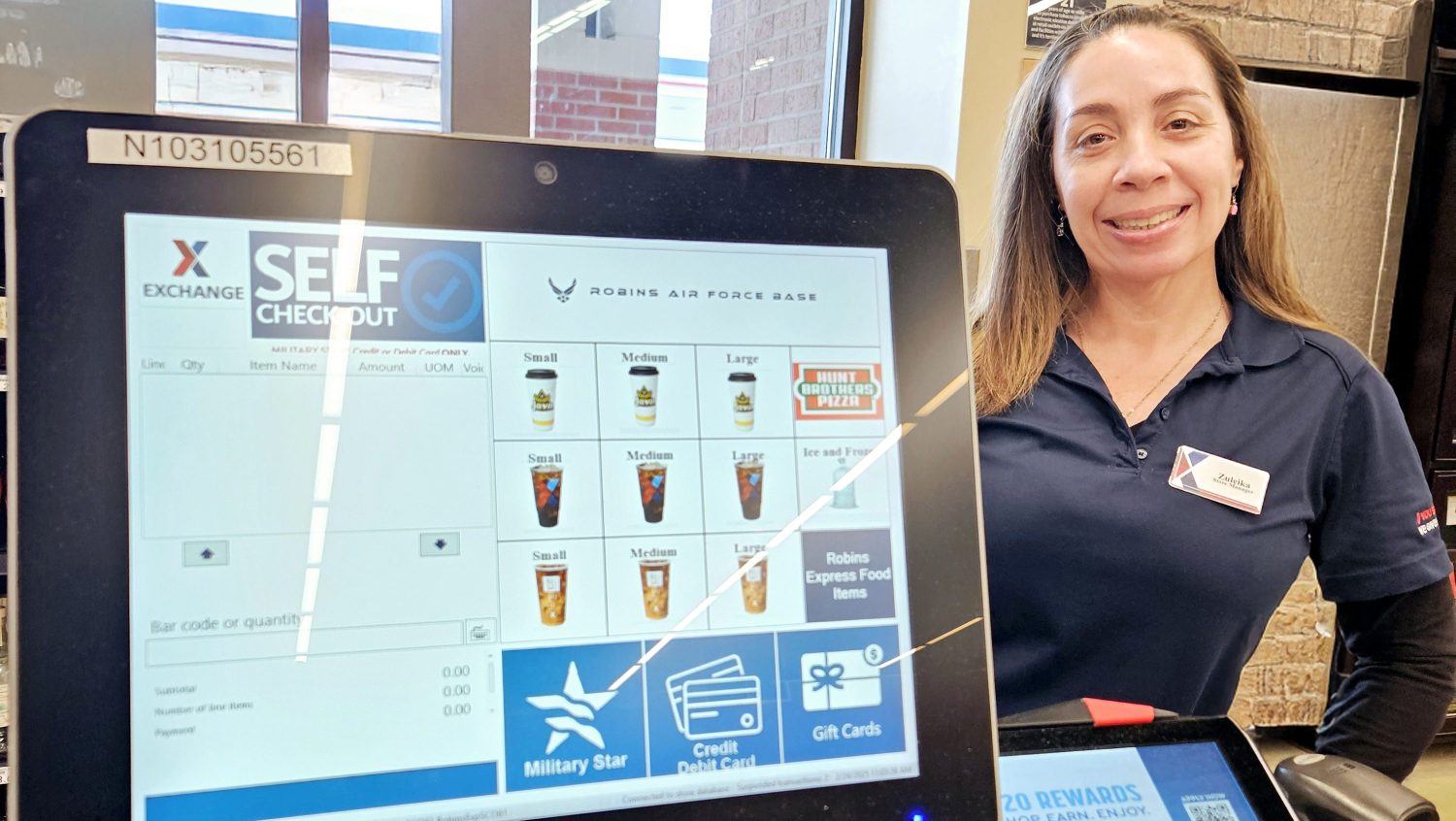 Image-ExPost-Fix <b>Robins AFB Express Manager Zuleika Peña with the new self-checkout dashboard.</b>