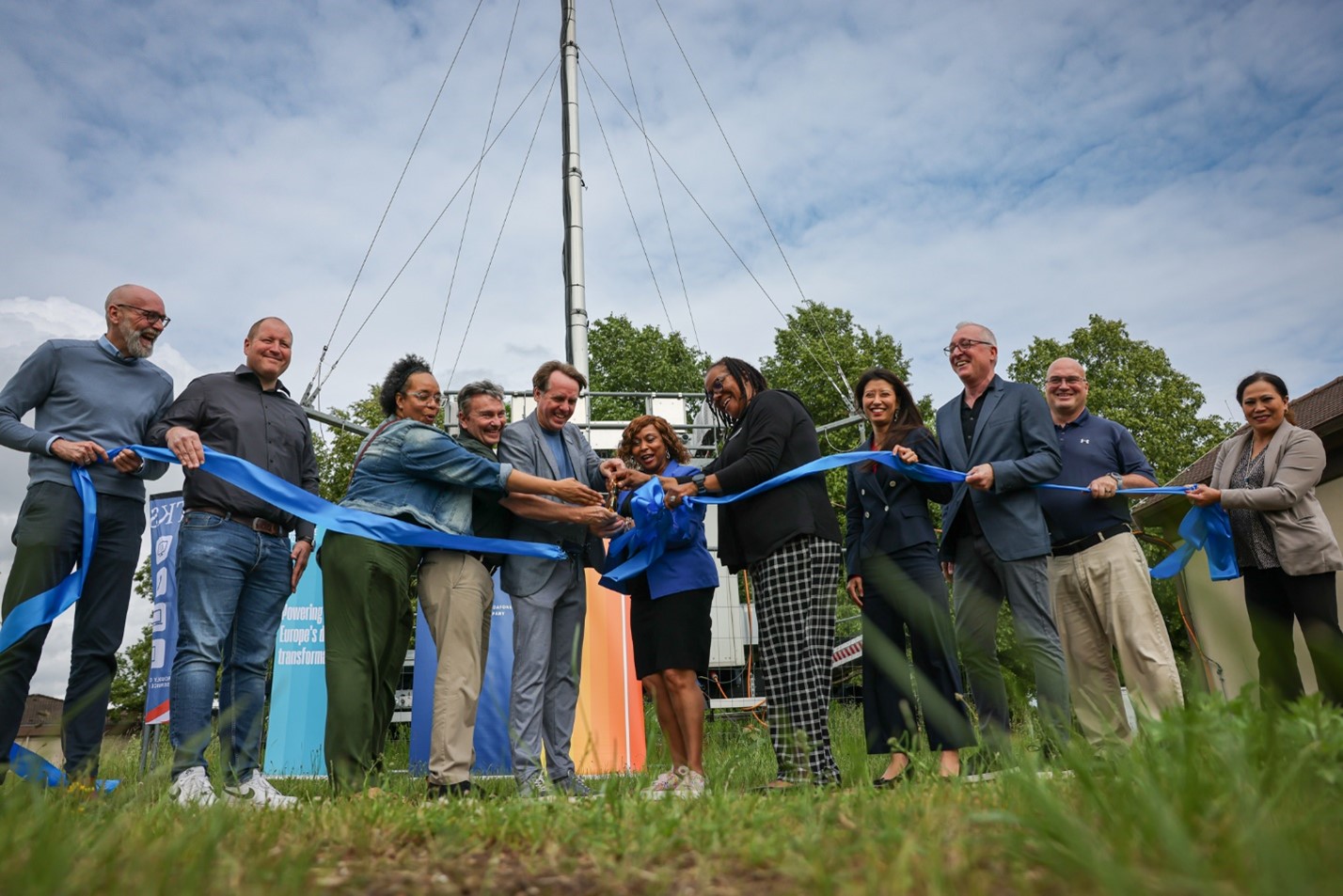 Leaders from the Exchange, TKS and Vantage Towers cut a ribbon during an opening ceremony, commissioning a new temporary cell tower that will provide cell coverage for personnel on Ramstein Air Base while other permanent towers are constructed. Photo from left to right: Steffen Stueckmann - TKS Head of Sales Region North, Dennis Rueckert - TKS Director of Operations, Carla McDowell - Exchange General Manager,  Tim McNichol, Europe, Telecom Business Manager, Patrick Abram - TKS CEO, Denise Hunter - Exchange Vice President of Services Operations, Krystal McLaurin - Exchange Services Business Manager, Yuka Hamaguchi - Vantage Towers Key Account Manager Alexander Kroell -  TKS -Director Sales & Marketing, John Jennings - Exchange Services Program Specialist, Racquel Hinson - Exchange Regional Business Office.
