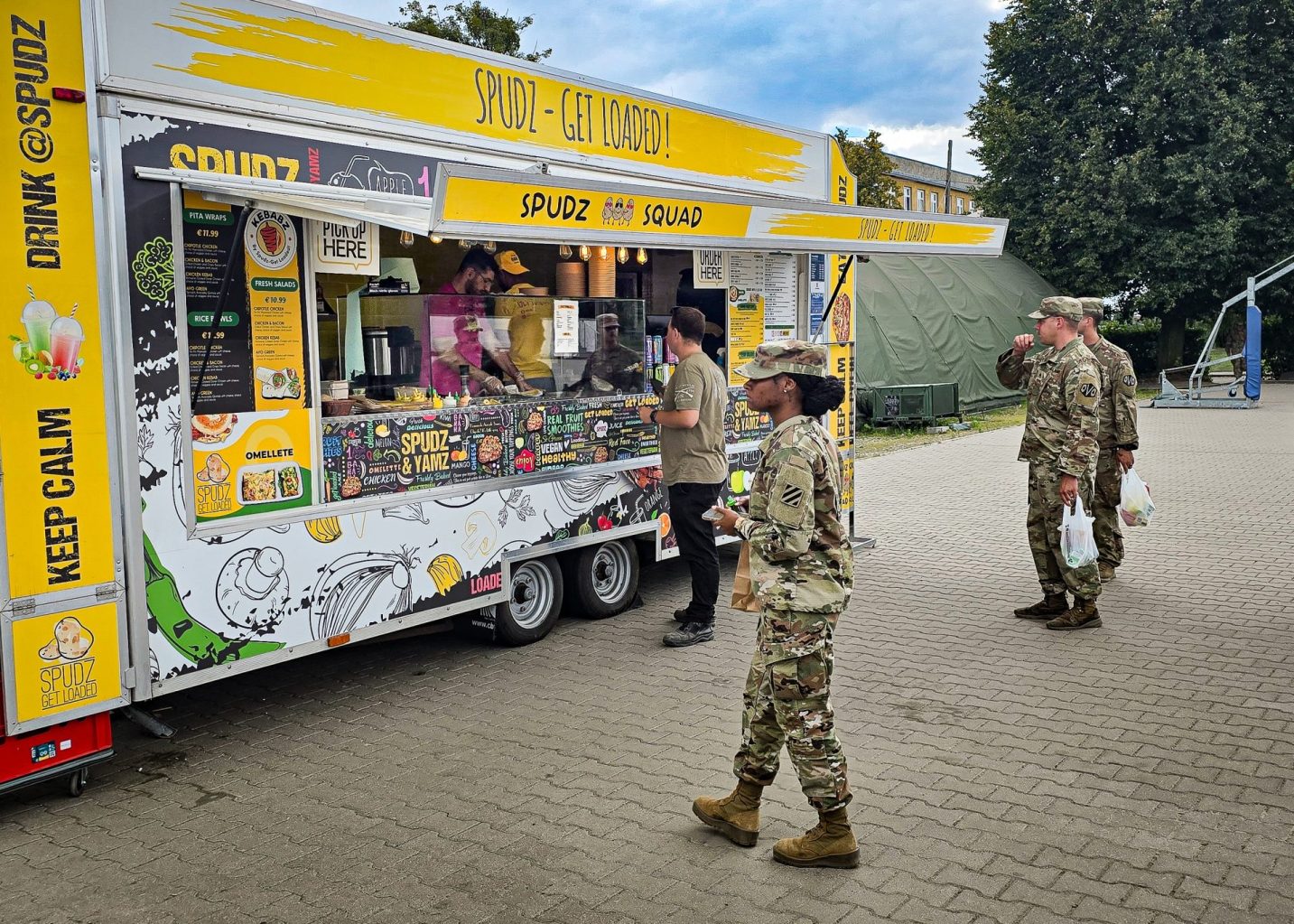Service members on Powidz Air Base check out Spudz, the first food truck opened by the Army & Air Force Exchange Service—marking a significant step toward enhancing the Quality of Life for service members stationed at remote locations.