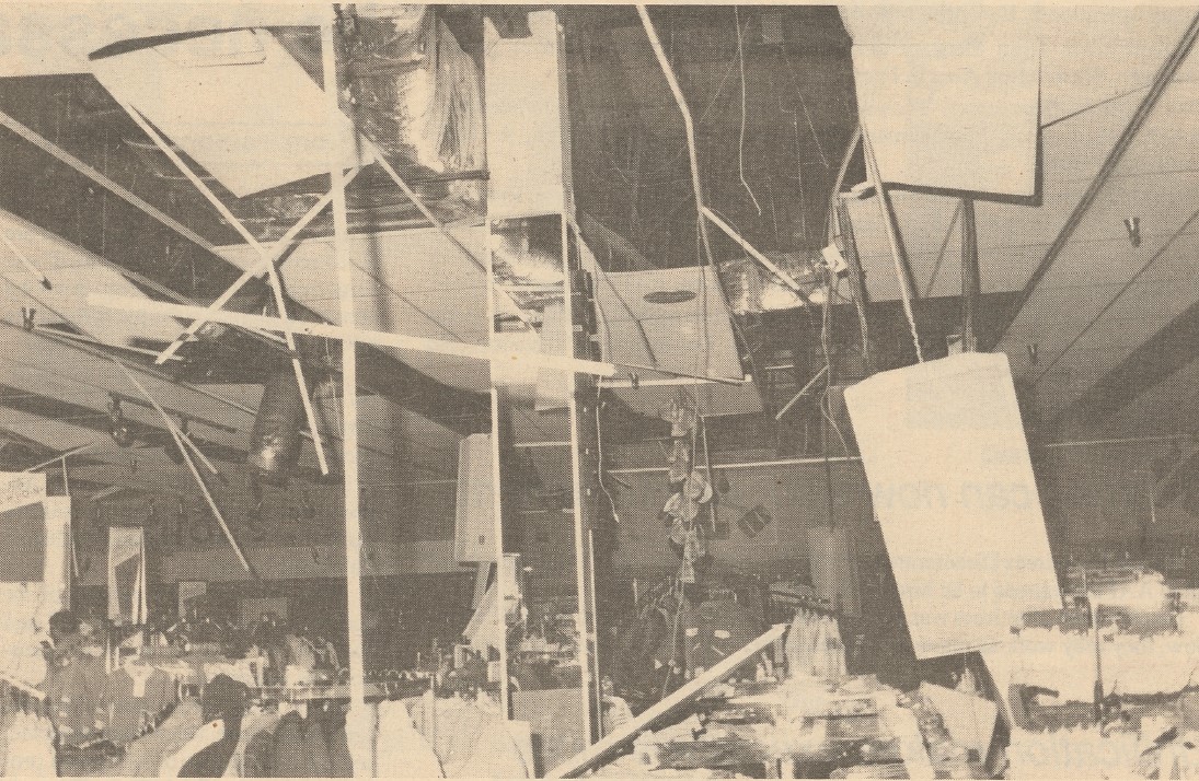 Newspaper photo of lights hanging from ceiling at Presidio of San Francisco Exchange after Oct. 17, 1989, earthquake.