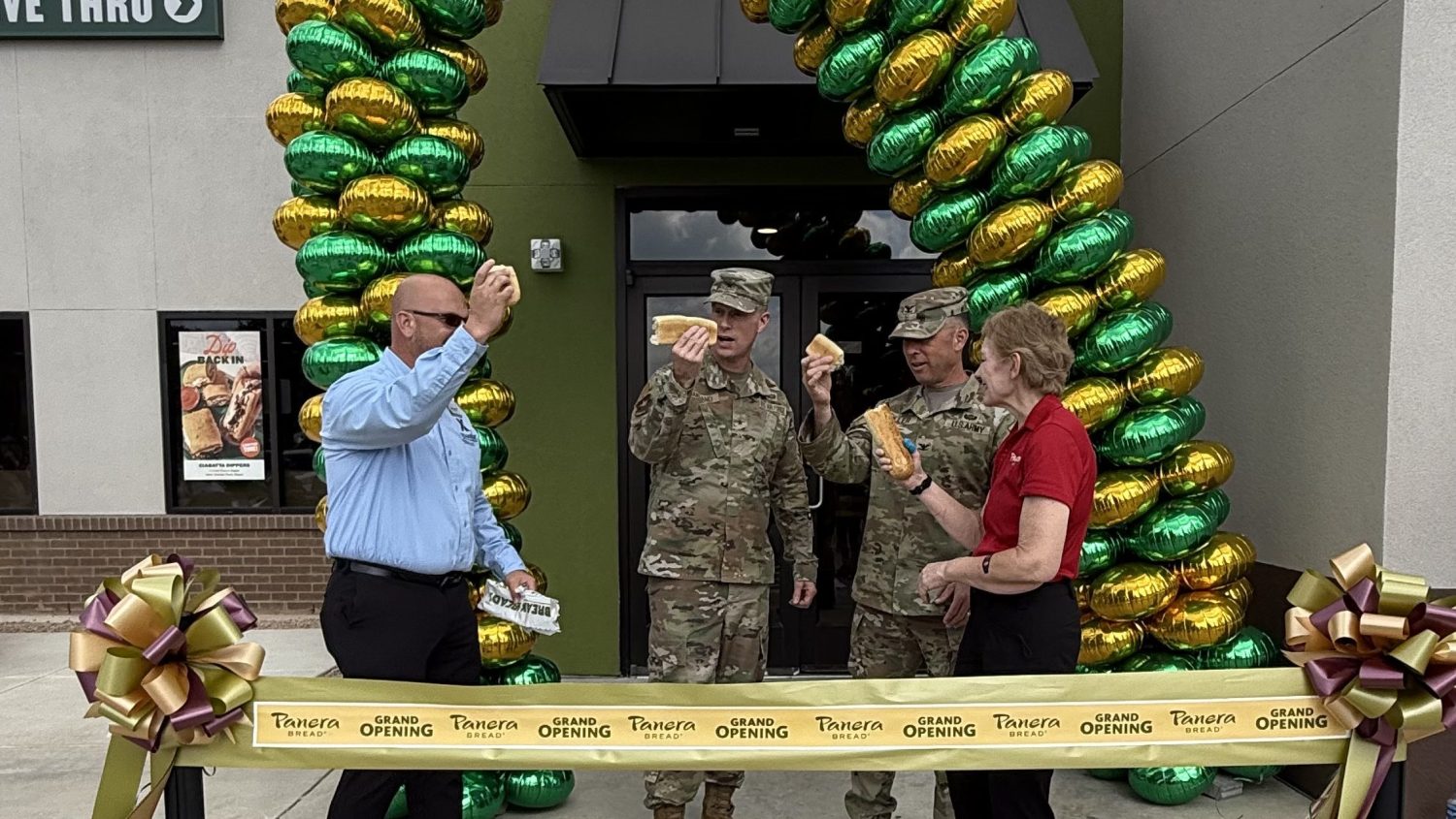 Exchange, anera and JBSA-Lackland officials (four people) prepare to cut the ribbon on a new Panera Bread.