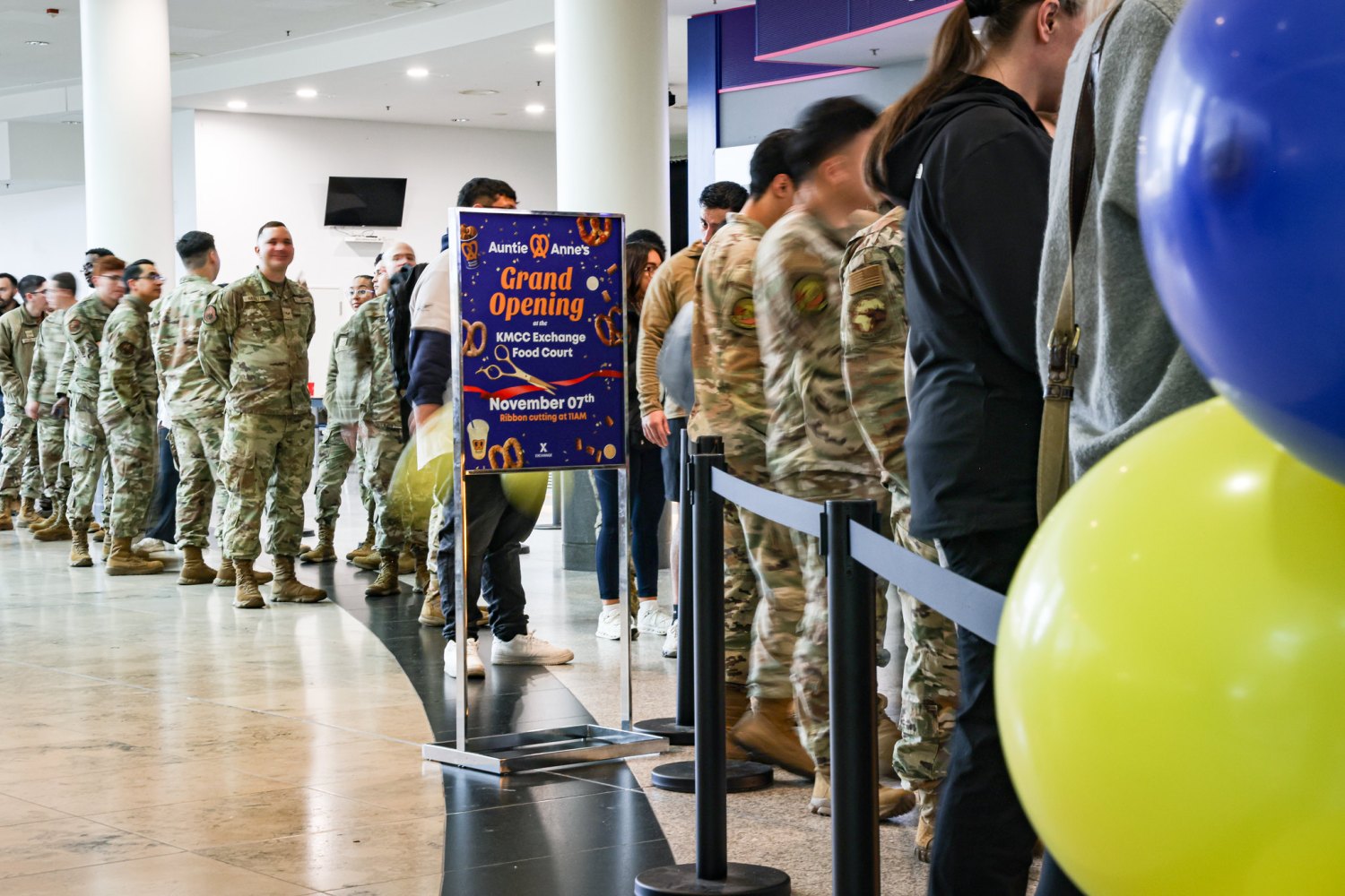 Long line of service members (going out of picture) awaiting grand opening of Auntie Anne's pretzels at Kaiserslautern Military Community in Germany