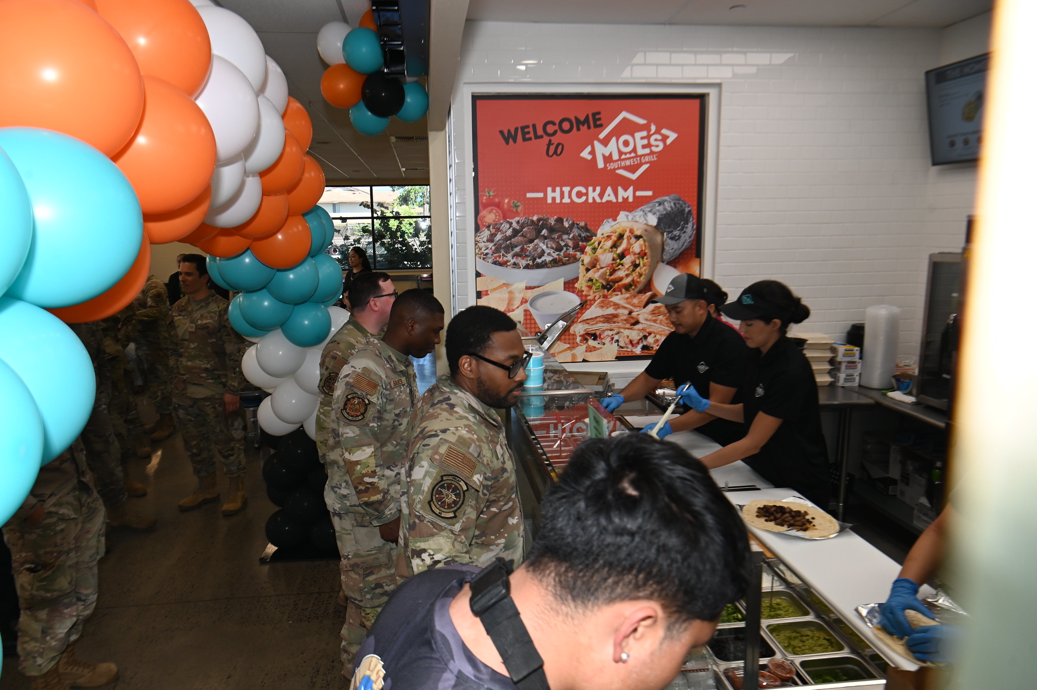 Airmen line up at Moe's Southwest Grill.