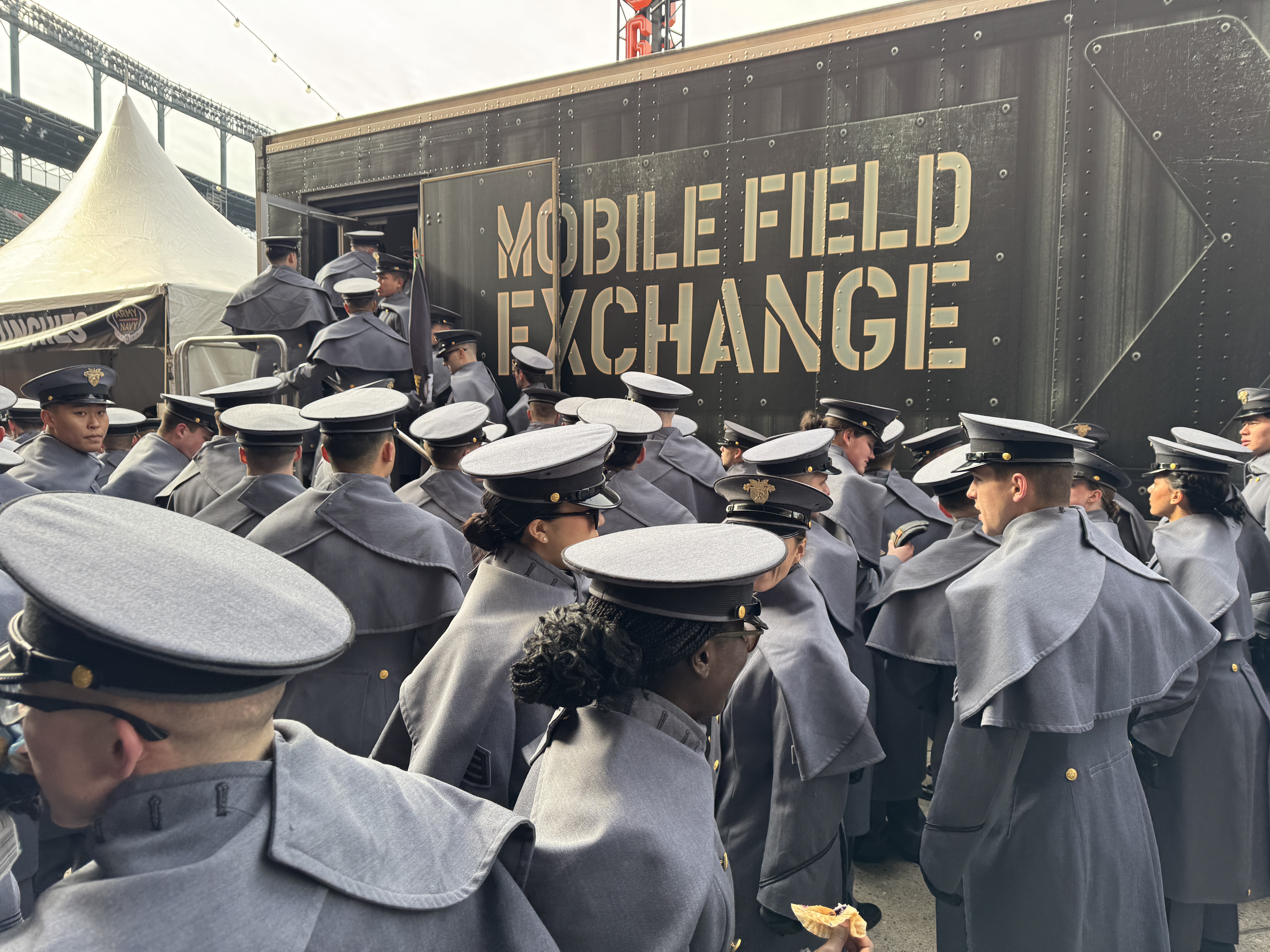 Cadets outside a mobile field Exchange.