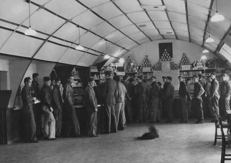 Servicemen lined up at counter.